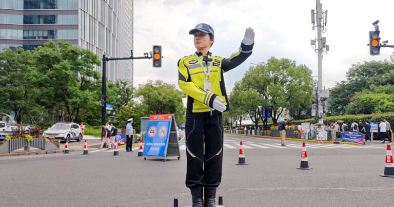 At China’s World AI Conference: Robot police, chips and Xi