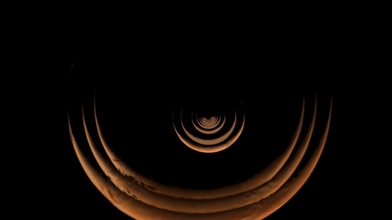 NASA’s Psyche Flyby Captures “Rarely Seen Views of the Red Planet” as Mars Appears as a Thin Red Crescent