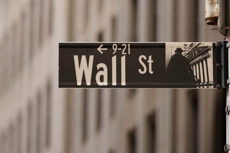 Most of Wall Street rises as oil prices ease, even as chip stocks keep dropping